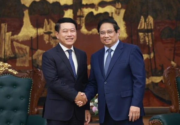 越南愿与老挝分享国企改革经验